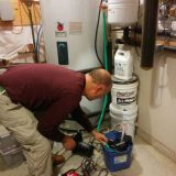 Tyson adjusting hoses on the two pump system